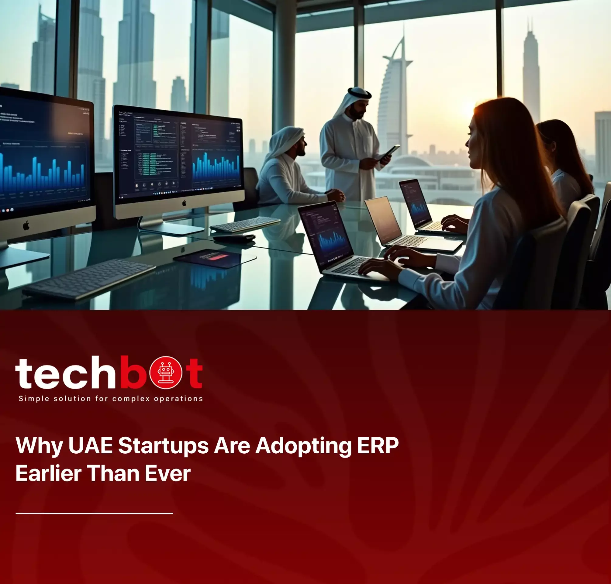 A UAE startup team discussing ERP implementation strategy with dashboards and cloud systems on-screen, showcasing modern digital transformation.